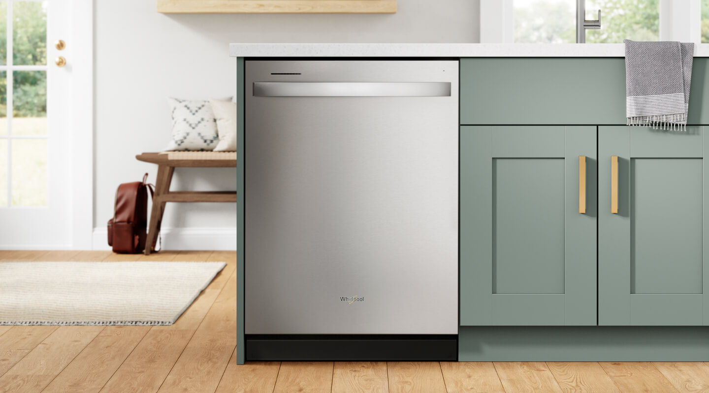 A Whirlpool® Dishwasher installed at the edge of a teal kitchen island