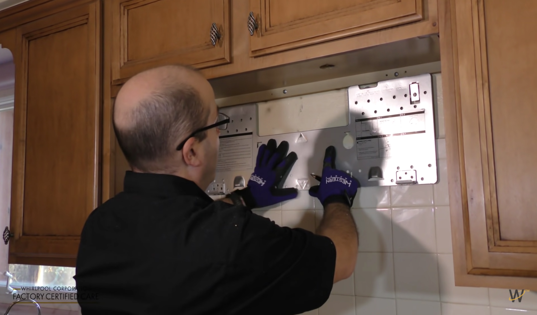 Mounting plate aligned against the wall