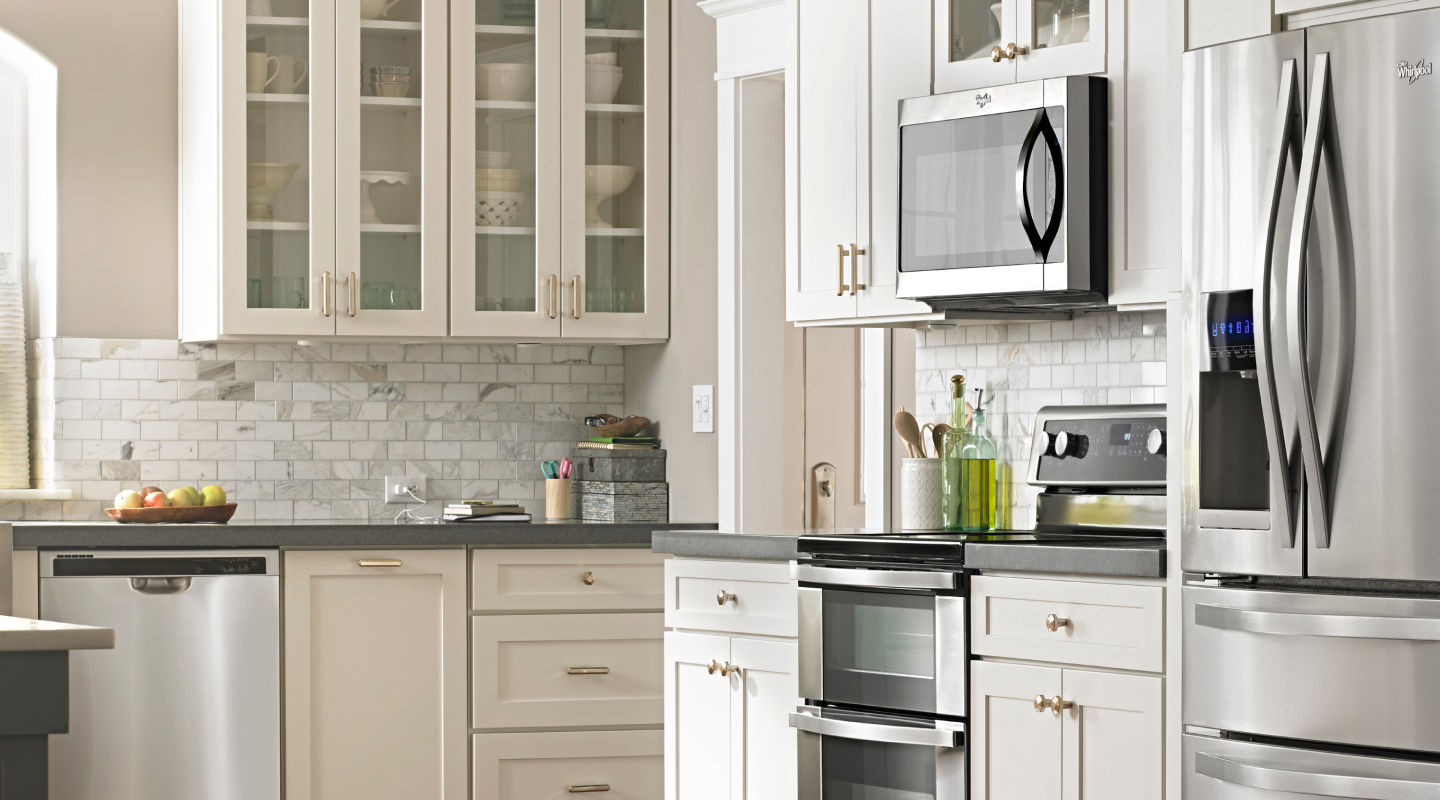 Bright, white kitchen with stainless steel appliances