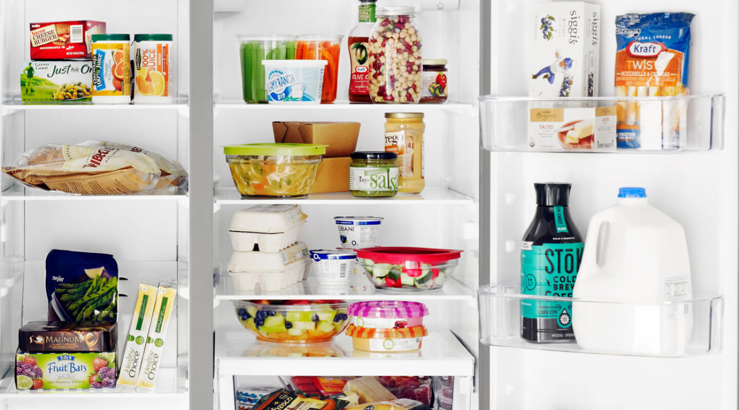 Groceries inside a side-by-side refrigerator