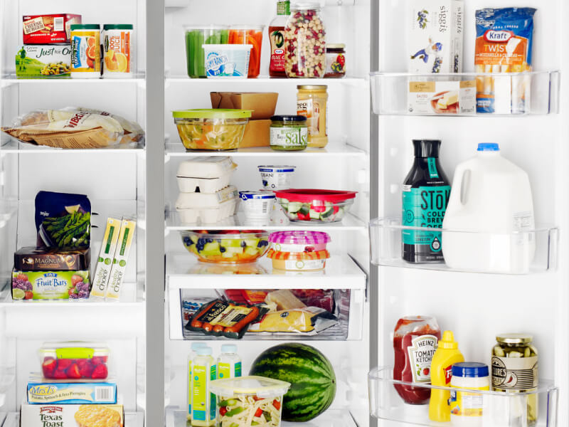 Groceries inside a side-by-side refrigerator
