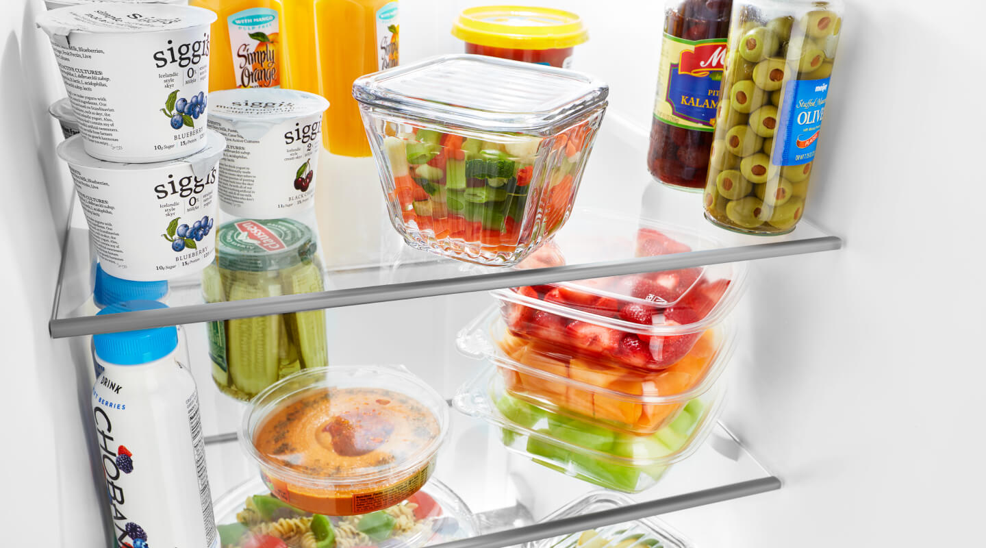 Produce and dairy products inside a refrigerator