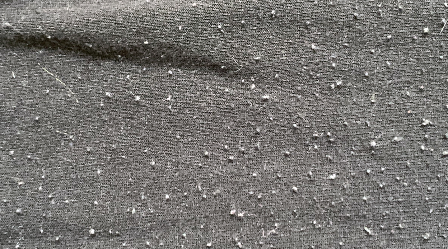 Pilling on gray fabric