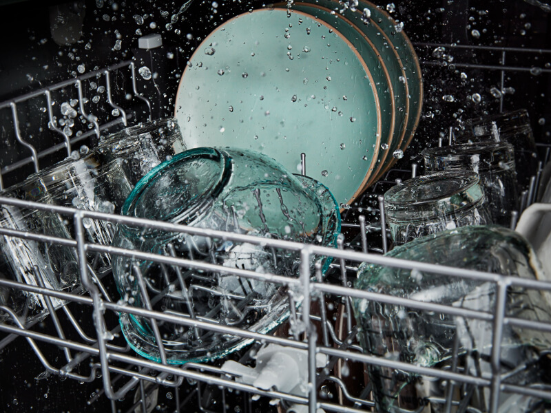 Glass bowl being washed in dishwasher