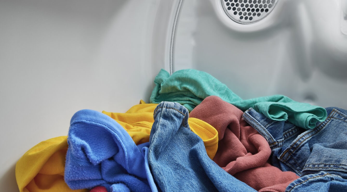 Colorful clothes in a dryer