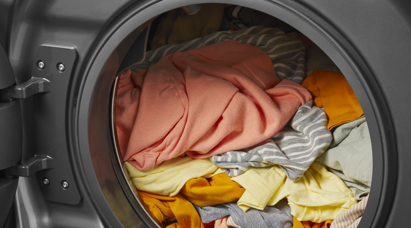 A washer filled with clothes