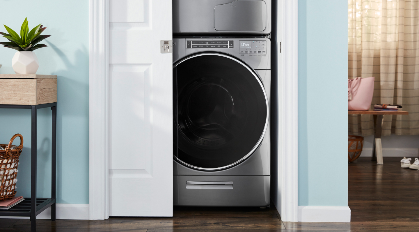 A front load washer in an open closet