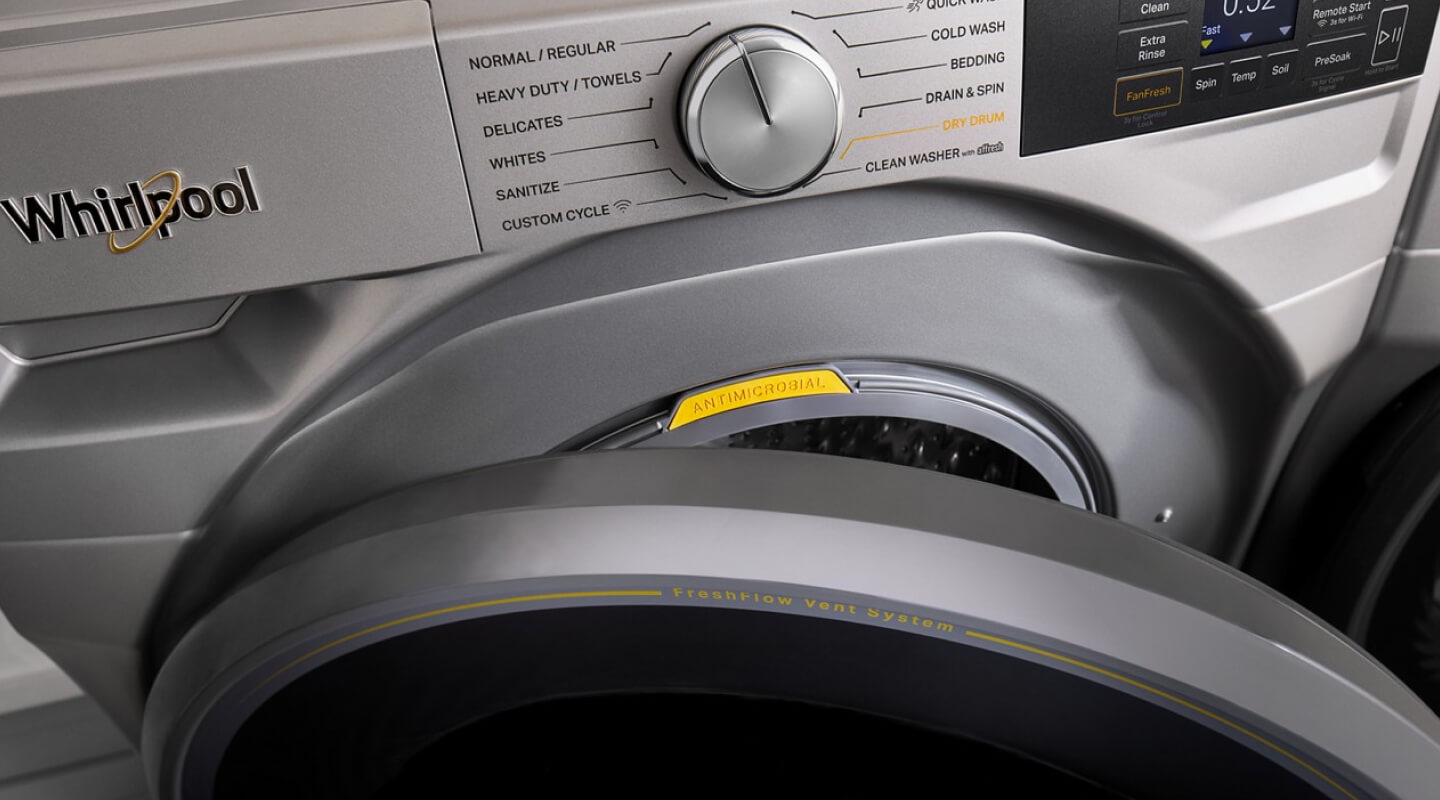 Close up of a front load washer with the door slightly open