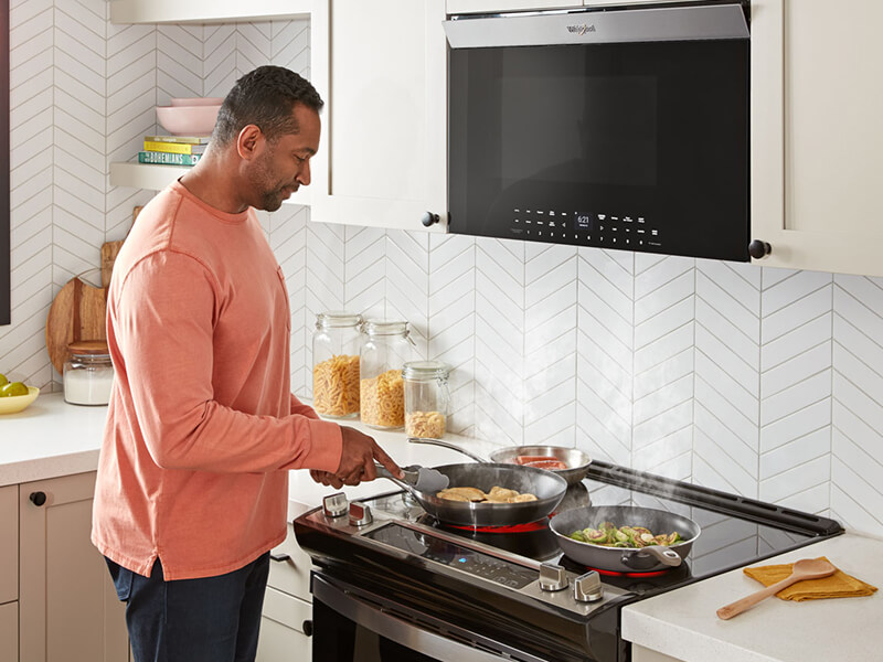 Person cooking on an electric range