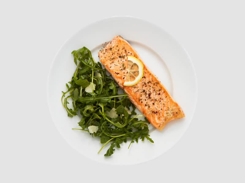 Fish and vegetables on a white plate