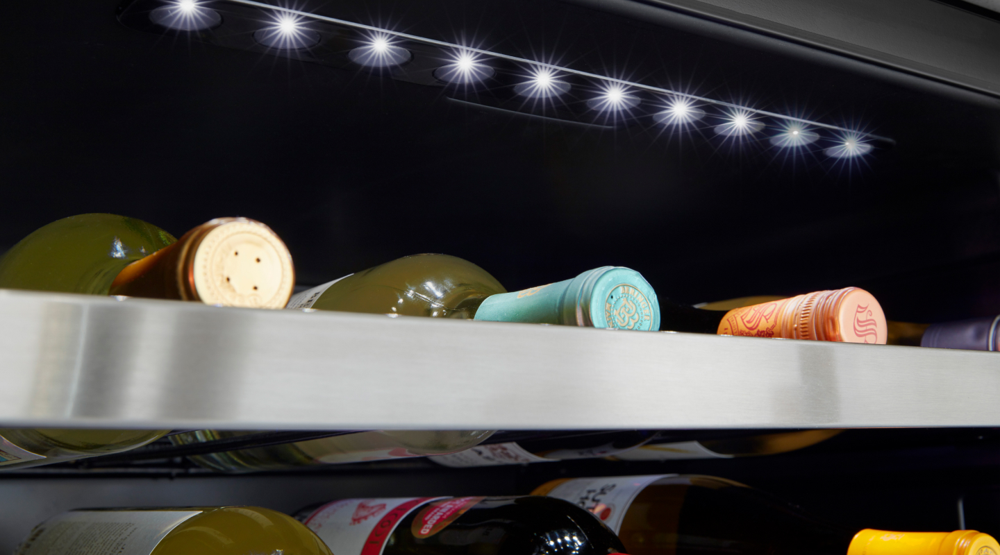 Wine bottles stored in a wine cooler