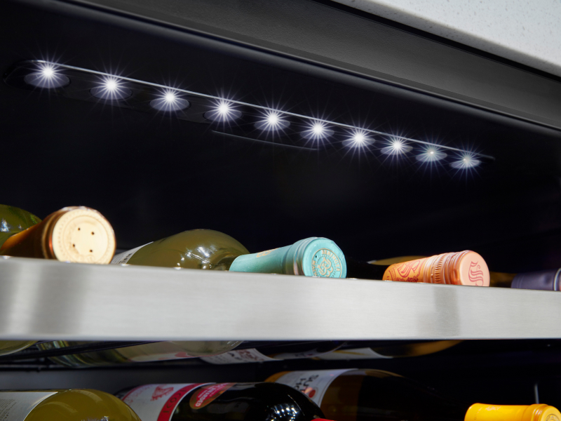 Wine bottles stored in a wine cooler