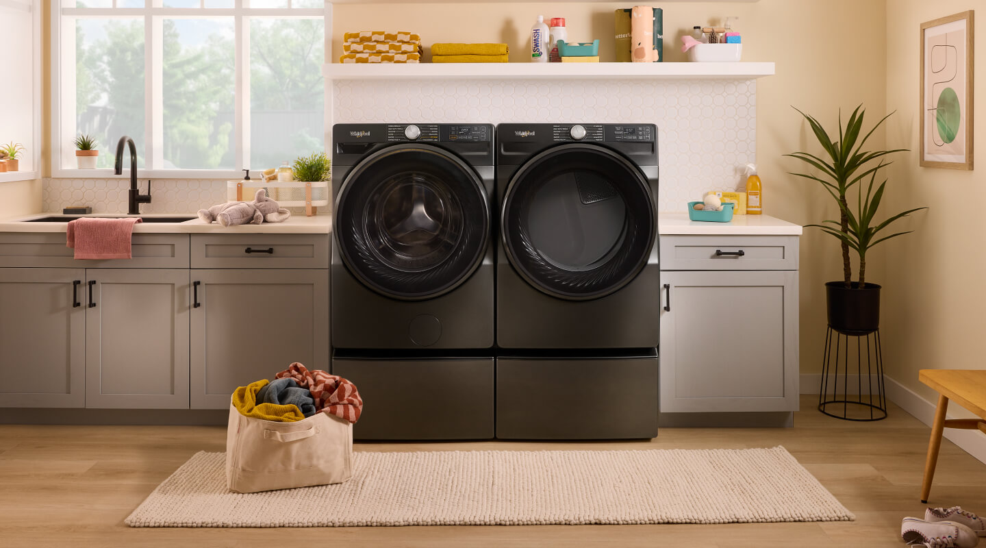 A bright laundry area with a Whirlpool® Washer and Dryer set