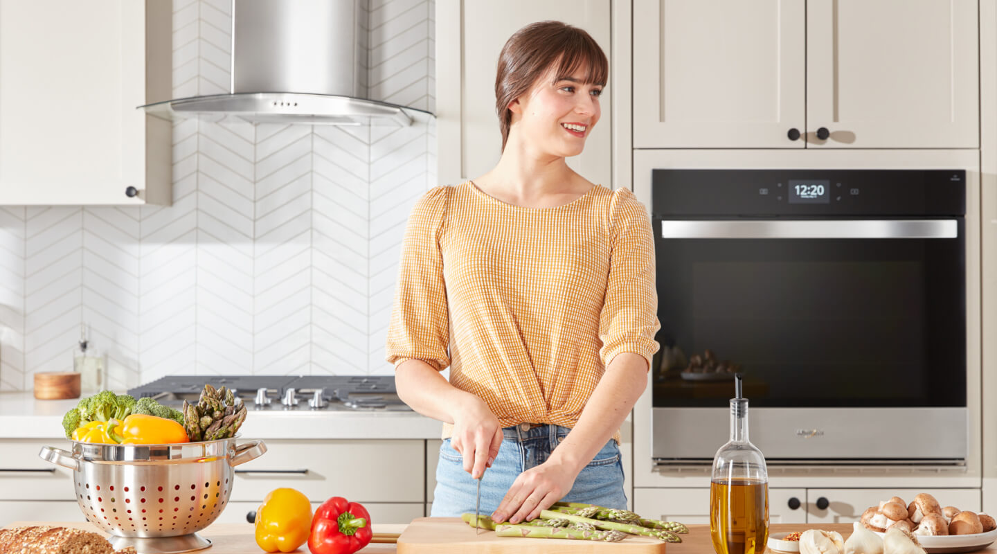 A person cutting asparagus