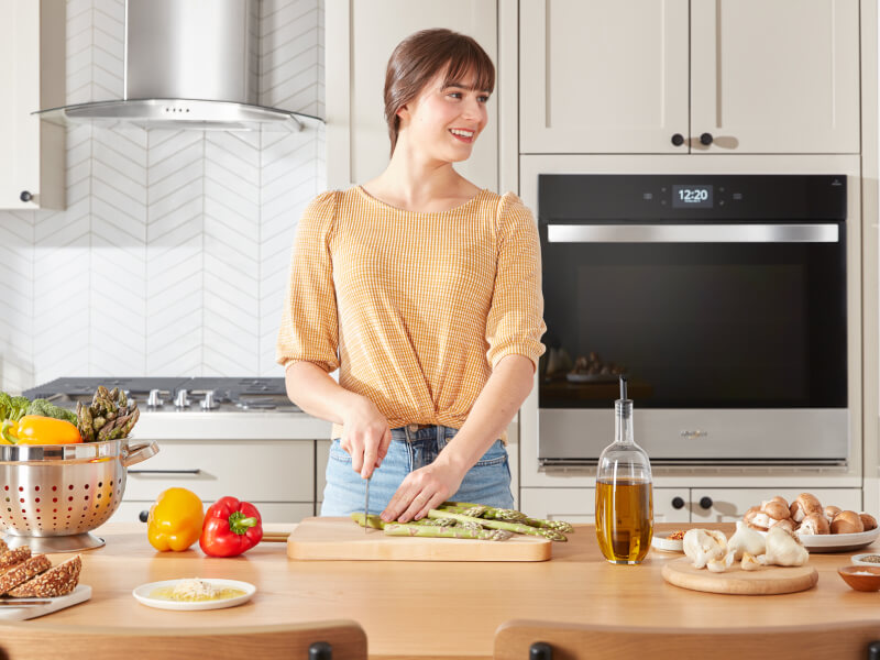 A person cutting asparagus