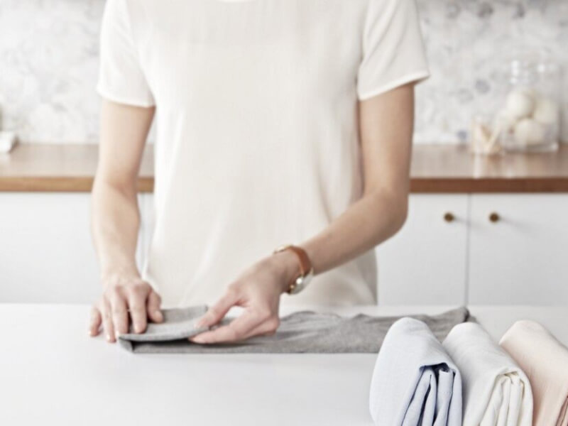 Person folding laundry