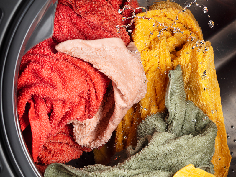 A closeup of laundry in a Whirlpool® washing machine.