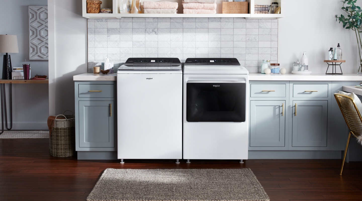 White Whirlpool® top loading washer and dryer