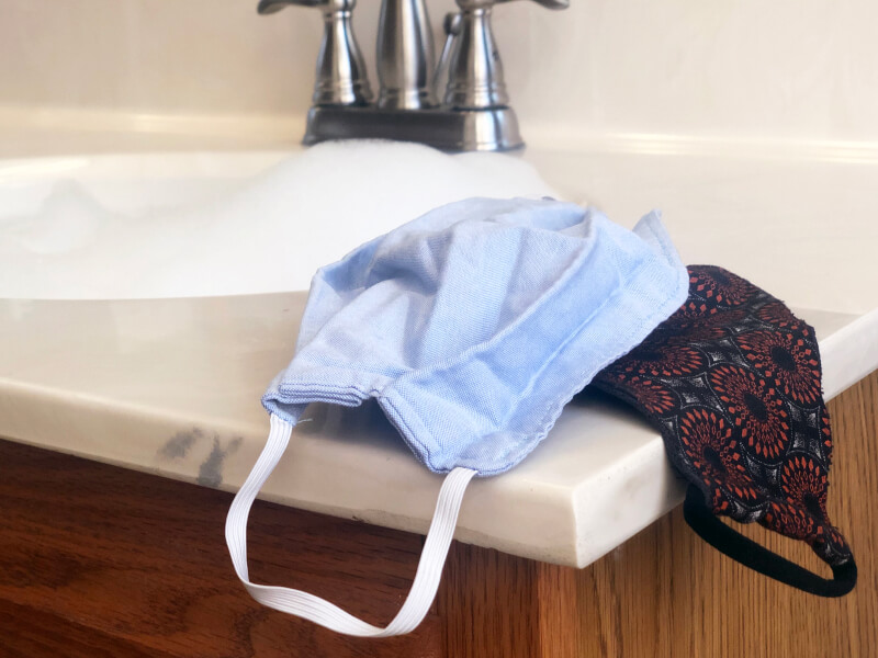 Cloth face masks next to a sink