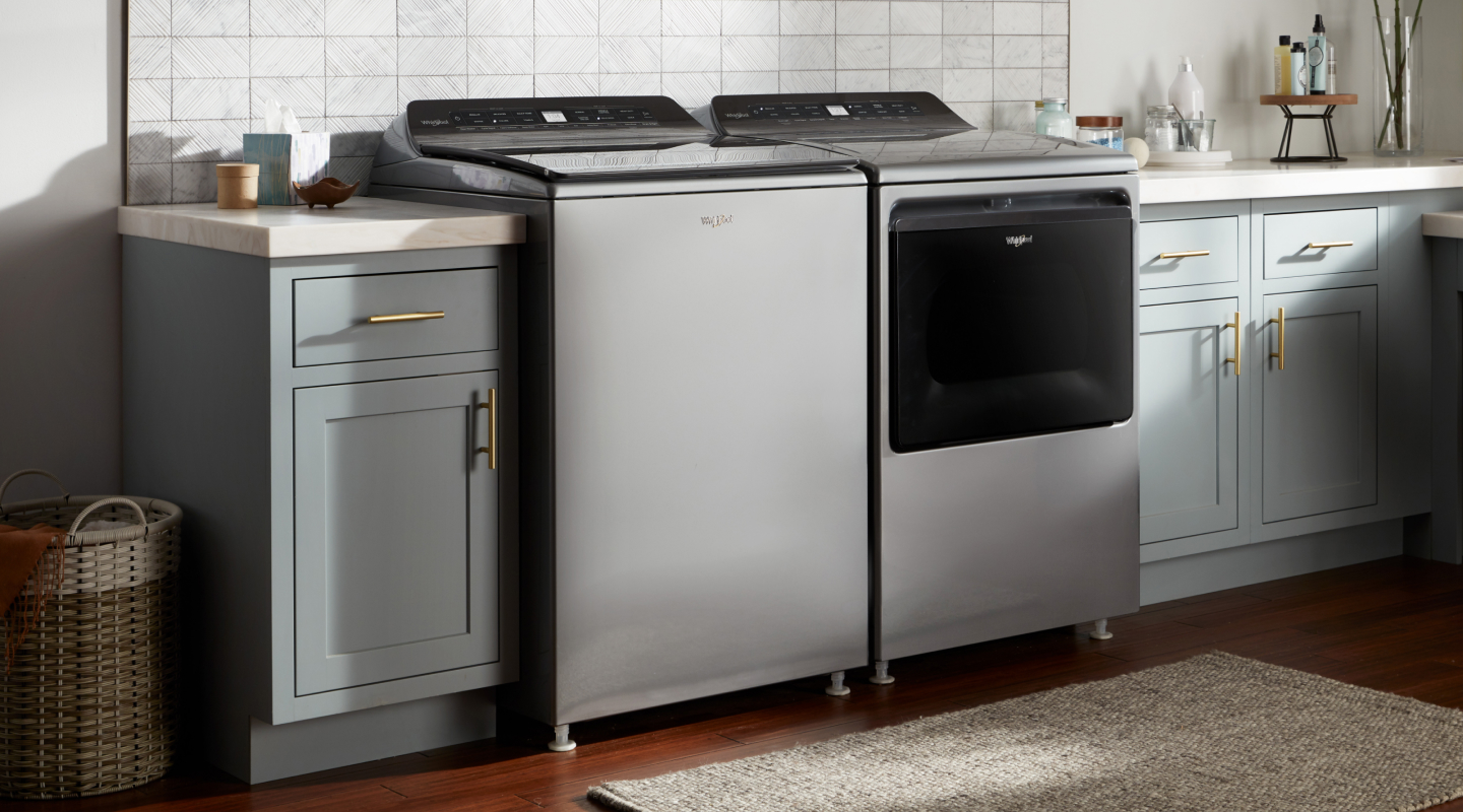 A gray washer and dryer set in a laundry room