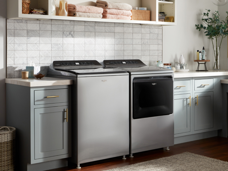 A gray washer and dryer set in a laundry room