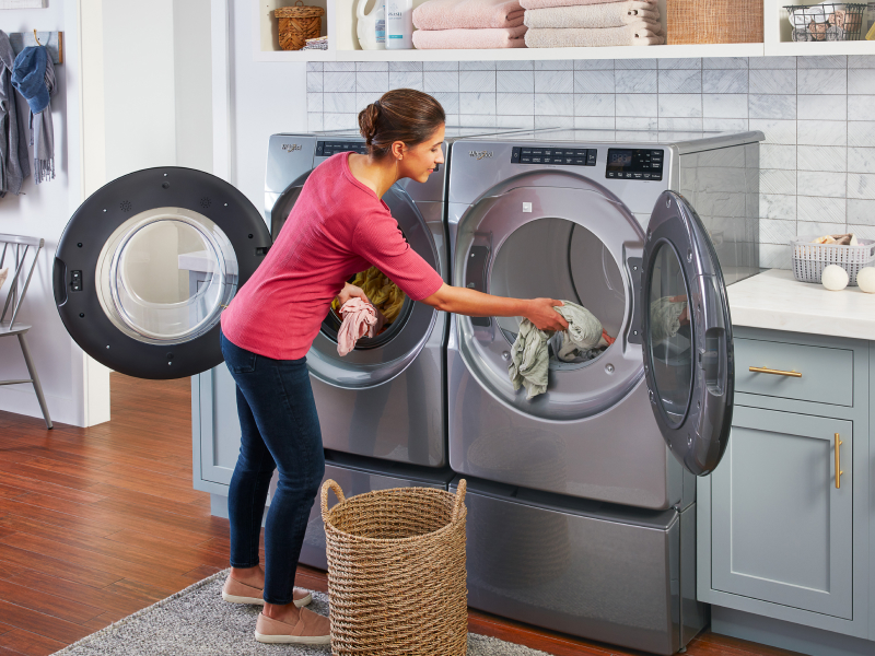 A woman loading laundry