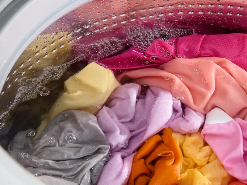Brightly colored clothing in a washing machine