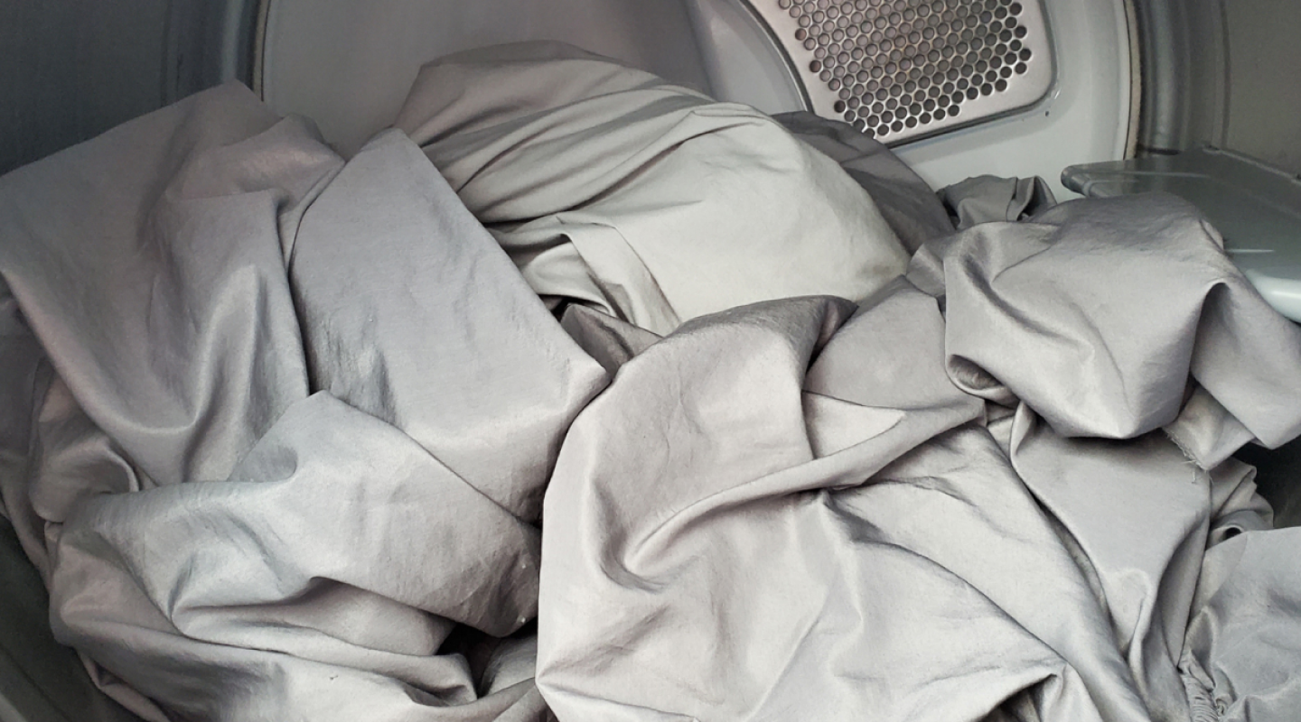 Interior of Whirlpool® dryer with sheets