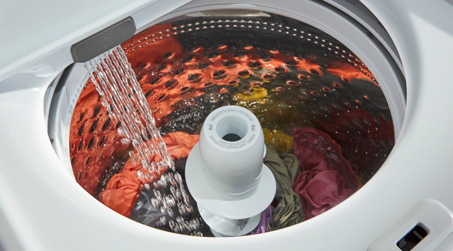 A washer drum filling with water