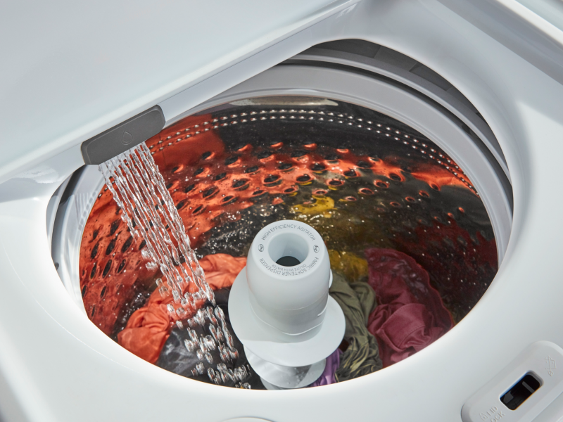 A washer drum filling with water