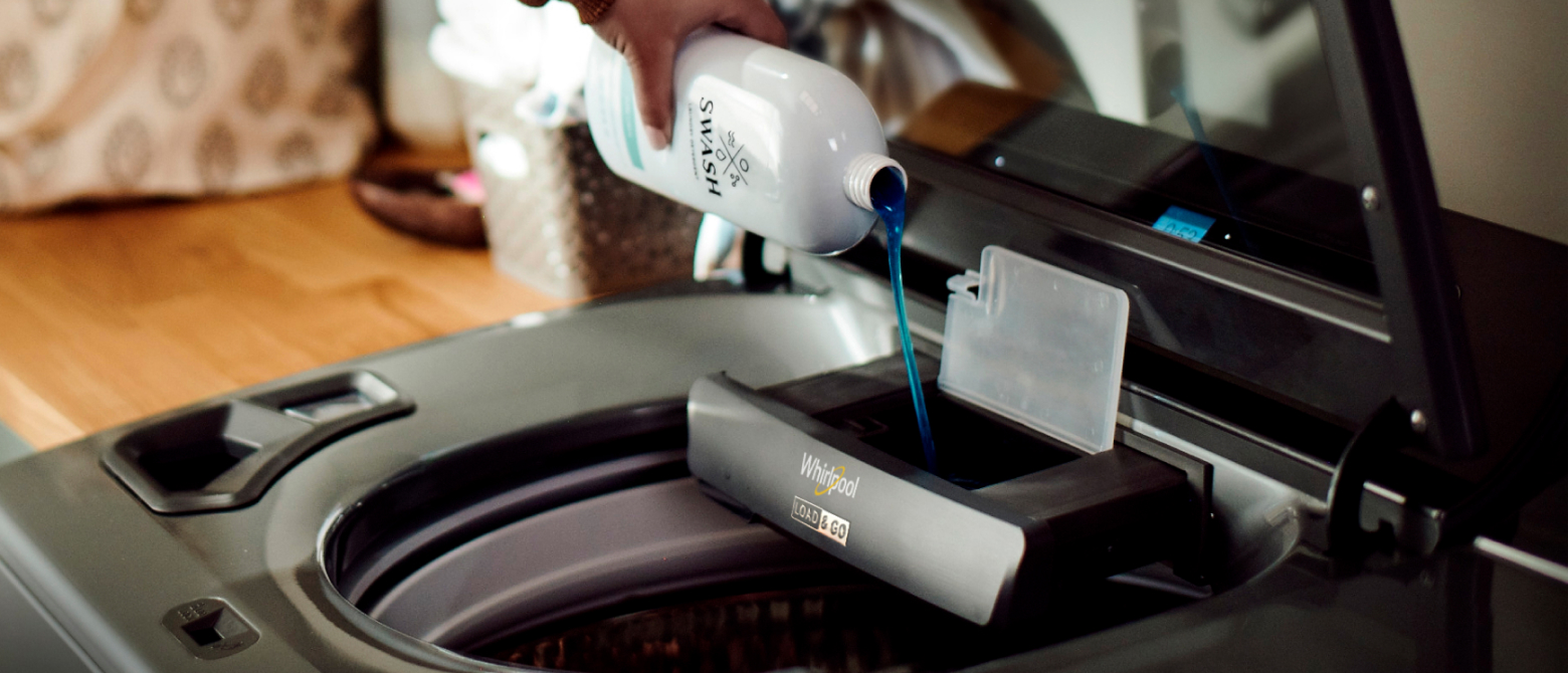 Swash™ Laundry Detergent being added to a Whirlpool® Load & Go™ Dispenser