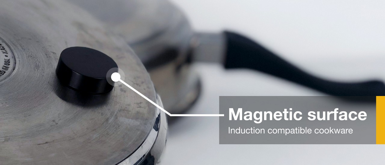 A magnet stuck to the bottom of induction compatible cookware 