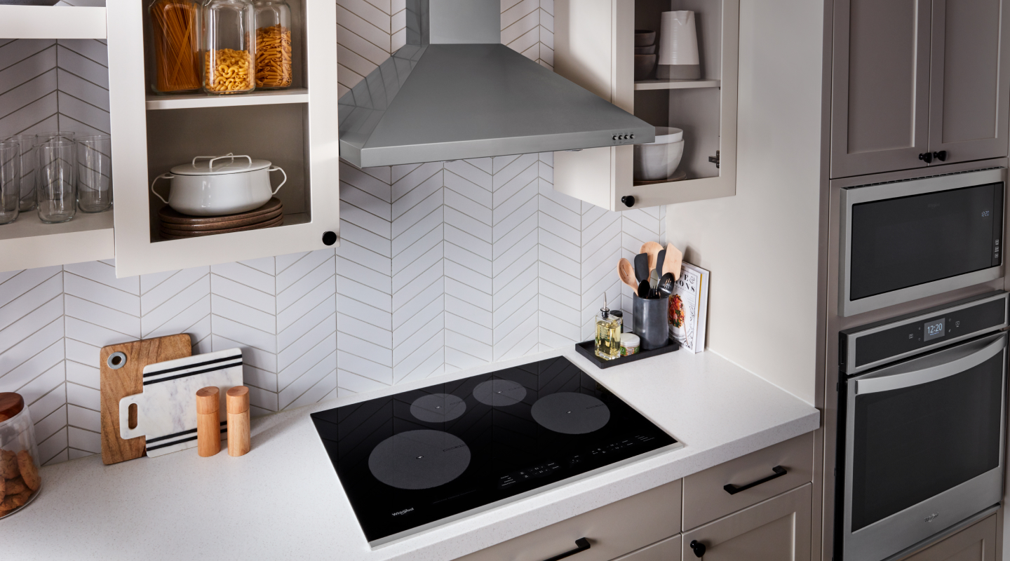 Whirlpool® Induction Stovetop below Whirlpool® Wall Mount Range Hood 