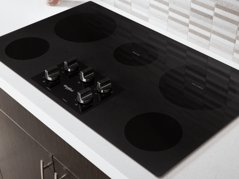 Whirlpool® Electric Stovetop installed in a white countertop