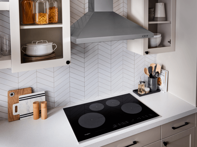 Whirlpool® Induction Stovetop below Whirlpool® Wall Mount Range Hood 