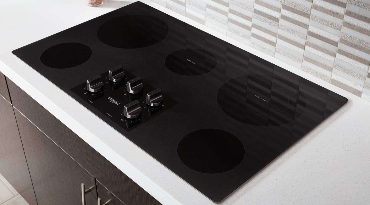 Whirlpool® Electric Stovetop installed in a white countertop