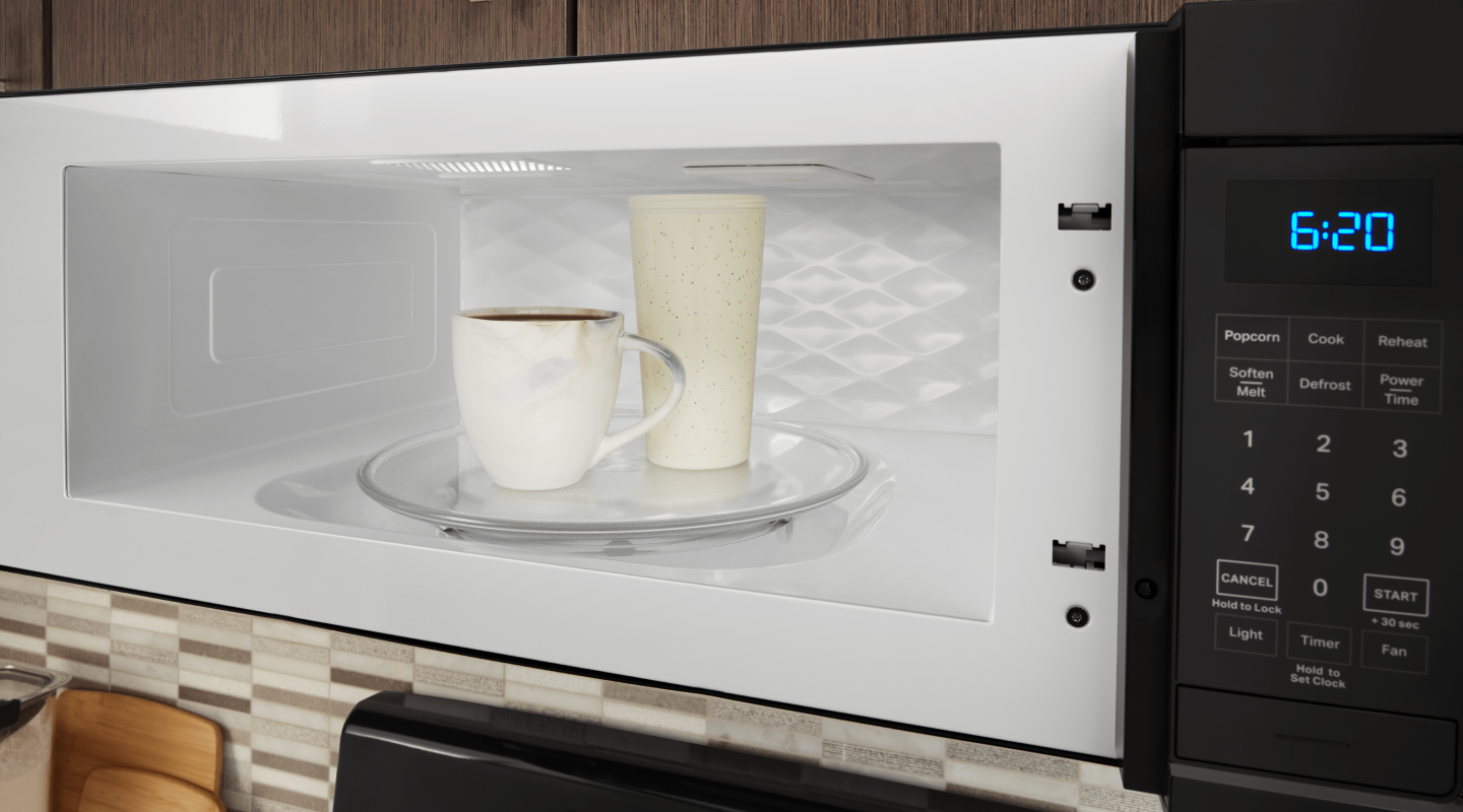 Two drink cups in a microwave