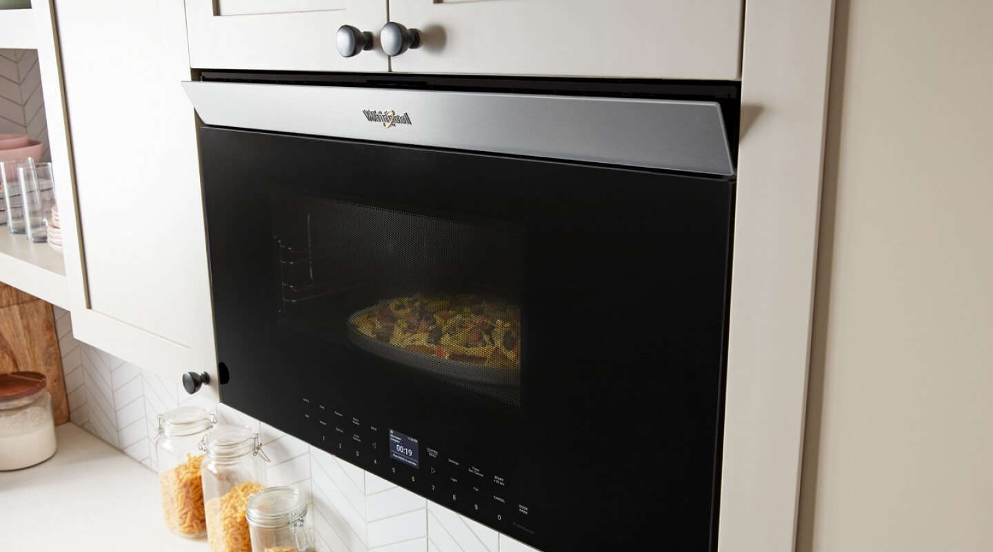 Whirlpool® Over-the-Range Microwave flush with cabinetry