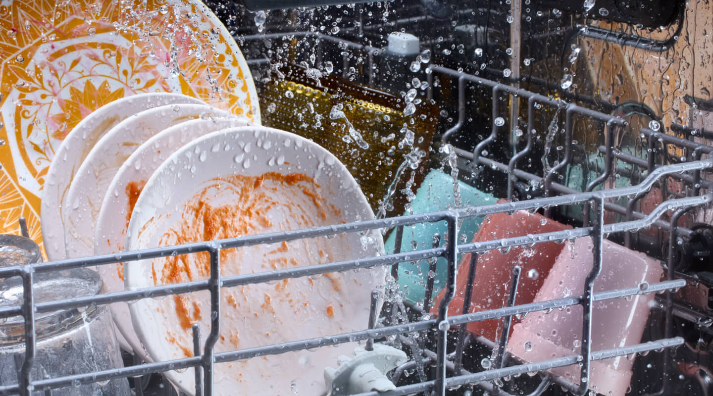 Dirty dishes washing in a dishwasher