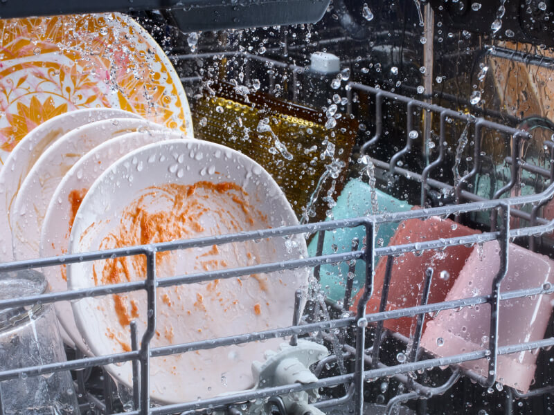 Dirty dishes washing in a dishwasher