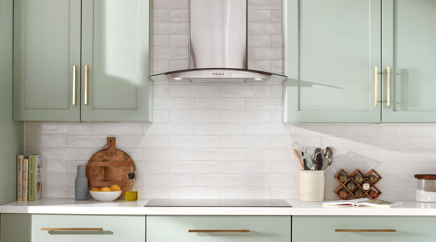 Range hood installed over an electric cooktop in a rustic kitchen