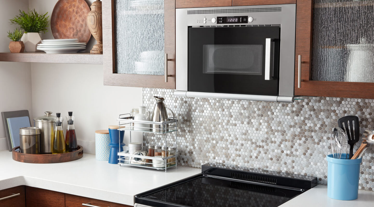 Whirlpool® over-the-range microwave installed above an electric cooktop