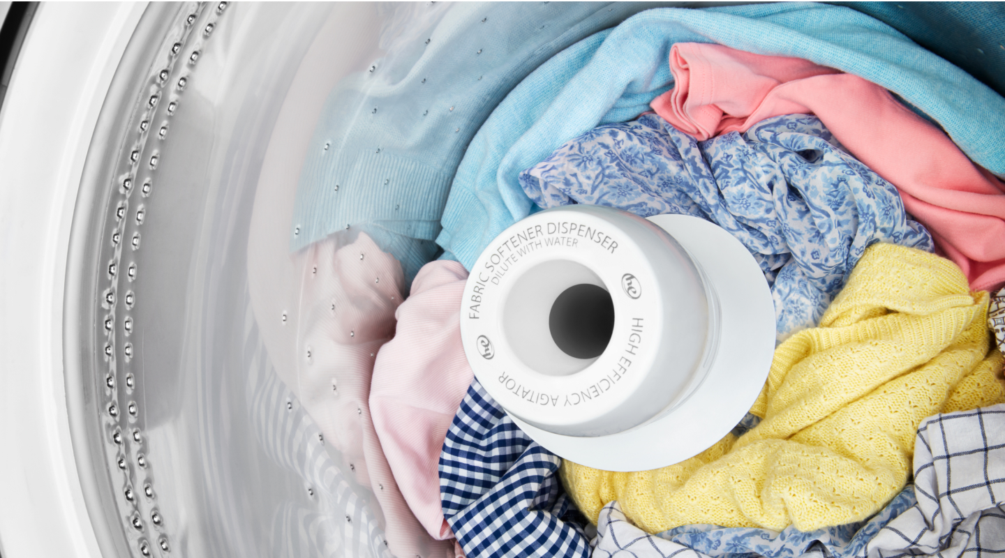 Clothes inside a top loading washing machine