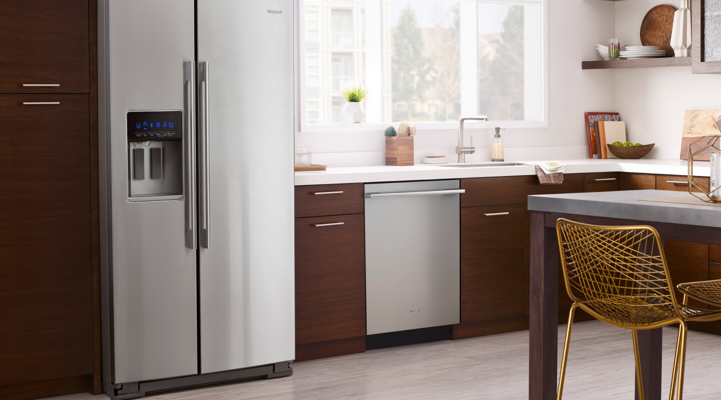 A modern wood cabinet kitchen with a counter depth refrigerator