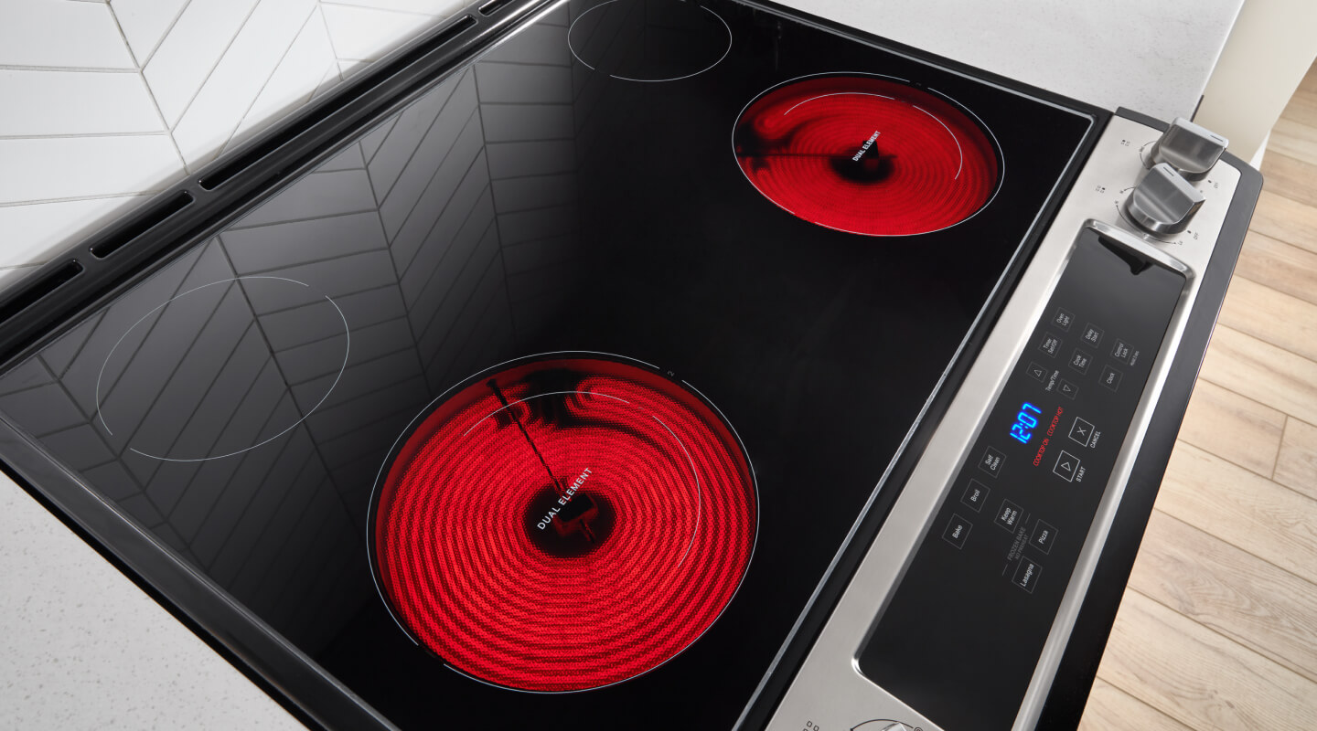 A glass surface stovetop with two burners warm