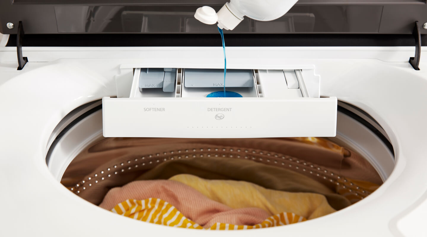 Detergent pouring into a detergent dispenser on a Whirlpool® Washer