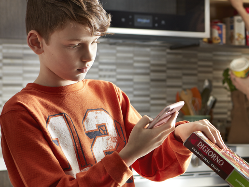 Person scanning a food barcode with a phone