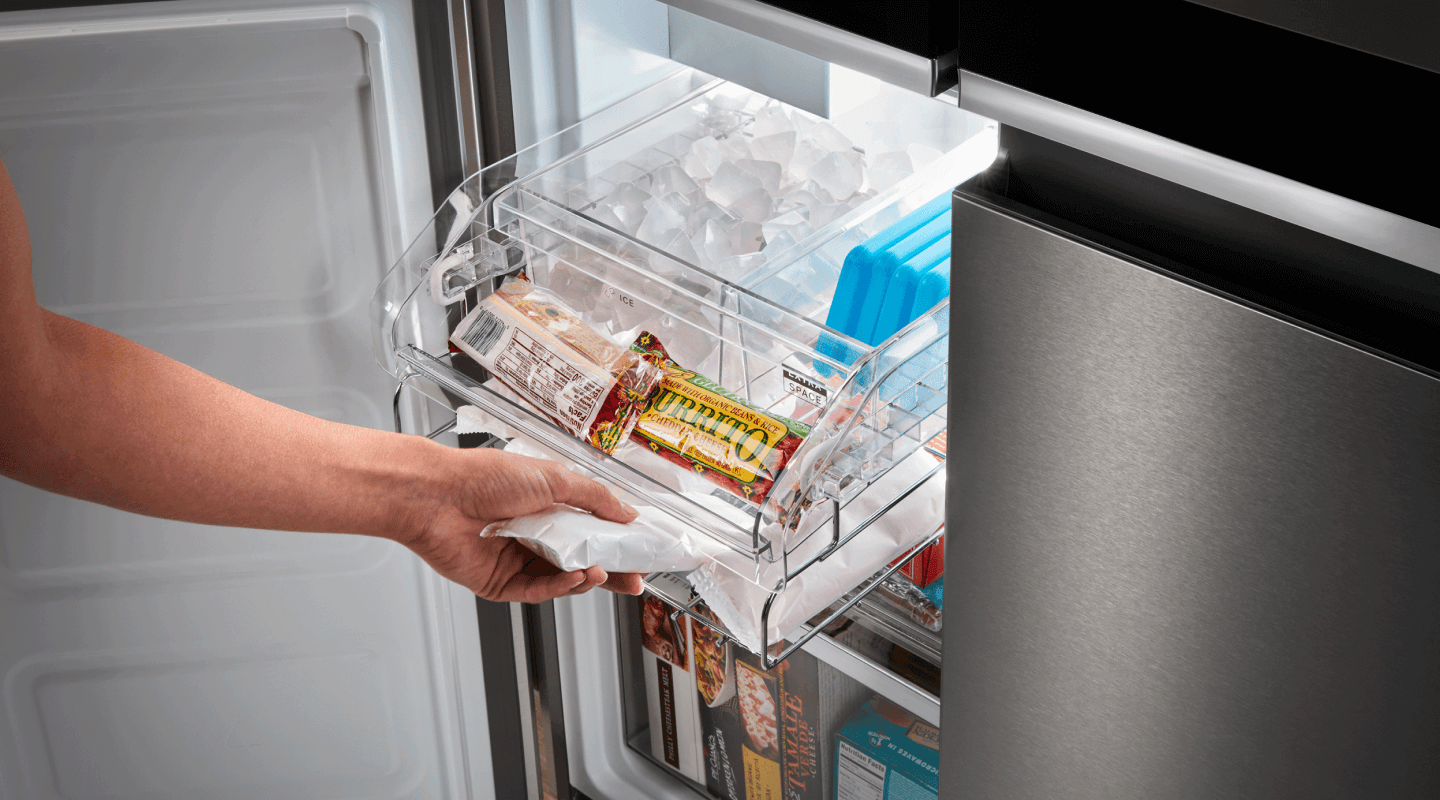 Person removing an item from a freezer