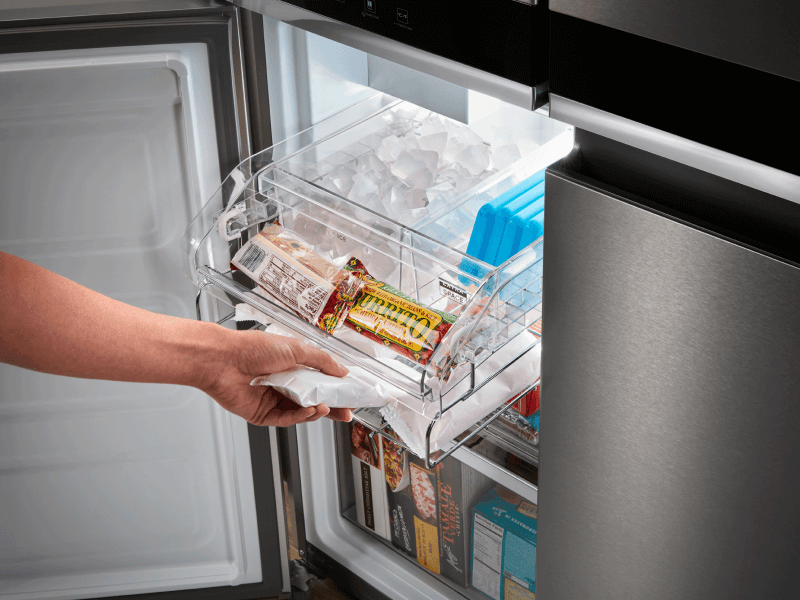 Person removing an item from a freezer