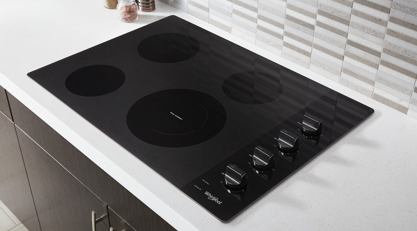 Whirlpool® Electric Cooktop installed in white countertop